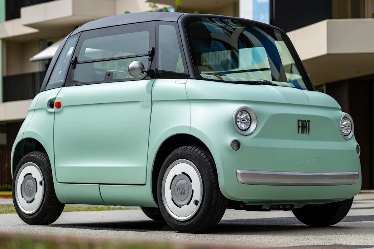 Fiat Topolino small electric city car parked on a narrow urban street