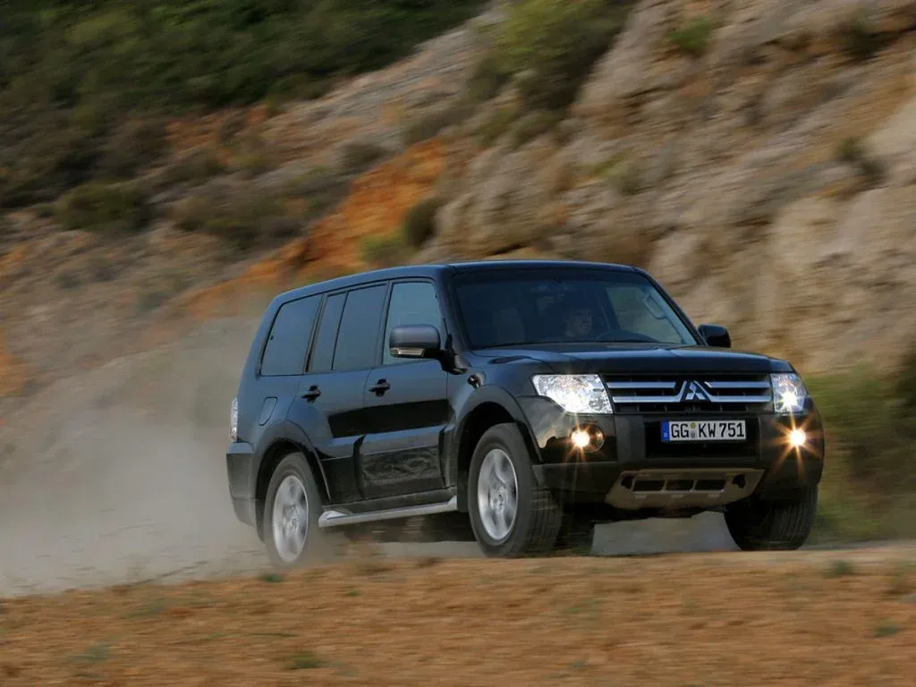 New Mitsubishi Pajero as a large seven-seat off-road vehicle on an unpaved mountain road