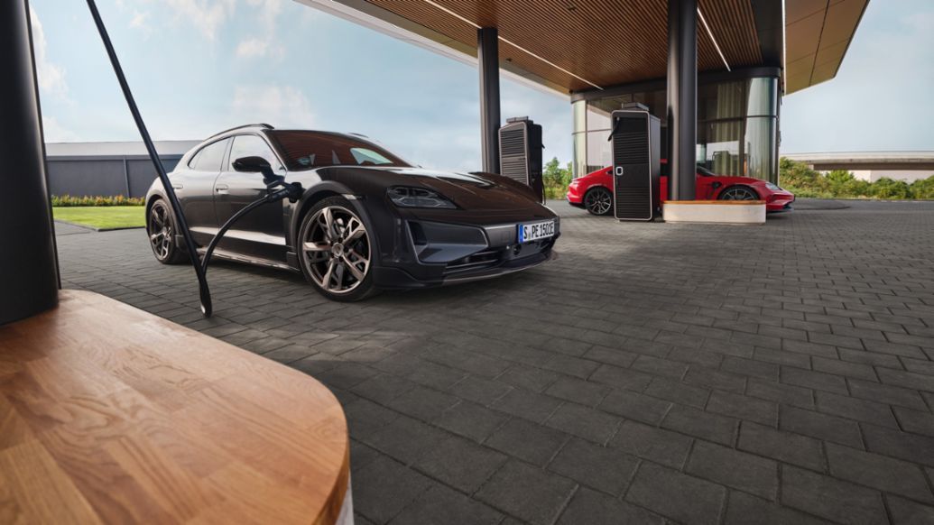 Porsche electric car at a charging station with a visible battery pack as a technical cutaway illustration
