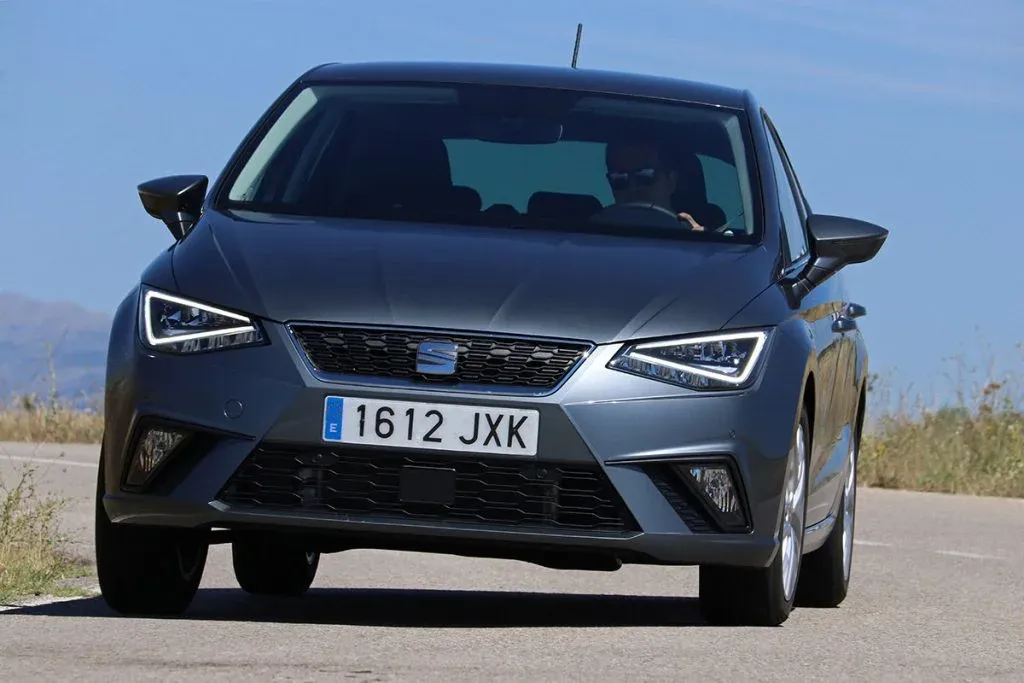 Refreshed SEAT Ibiza as a five-door small car on a winding road